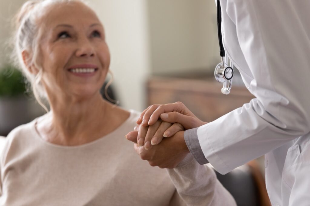 Happy,Senior,Woman,Visiting,Doctor,,Getting,Optimistic,News,After,Medical