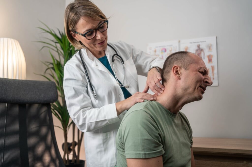 Man,Having,A,Neck,Pain.,Male,Undergoing,Physiotherapy,,Professional,Sport