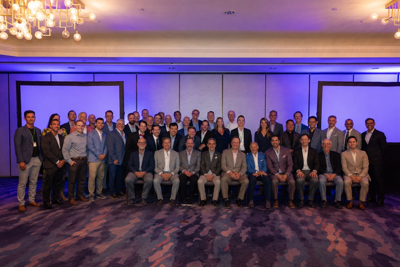 Group photo of SCOI’s past and graduating fellows in semi-formal wear at a recent event.